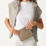 Model holding the Oyster Pouch 
