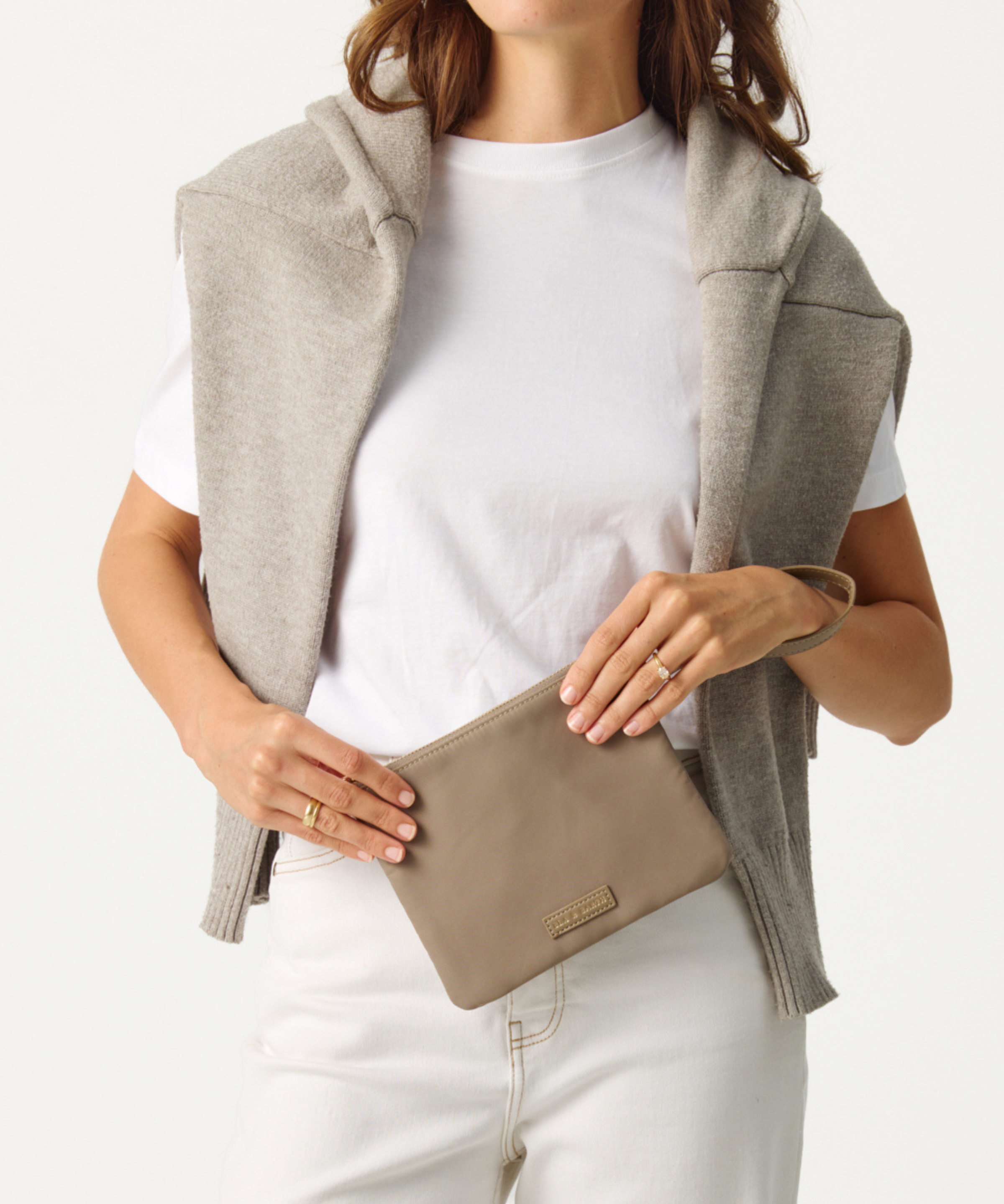 Model holding the Oyster Pouch 