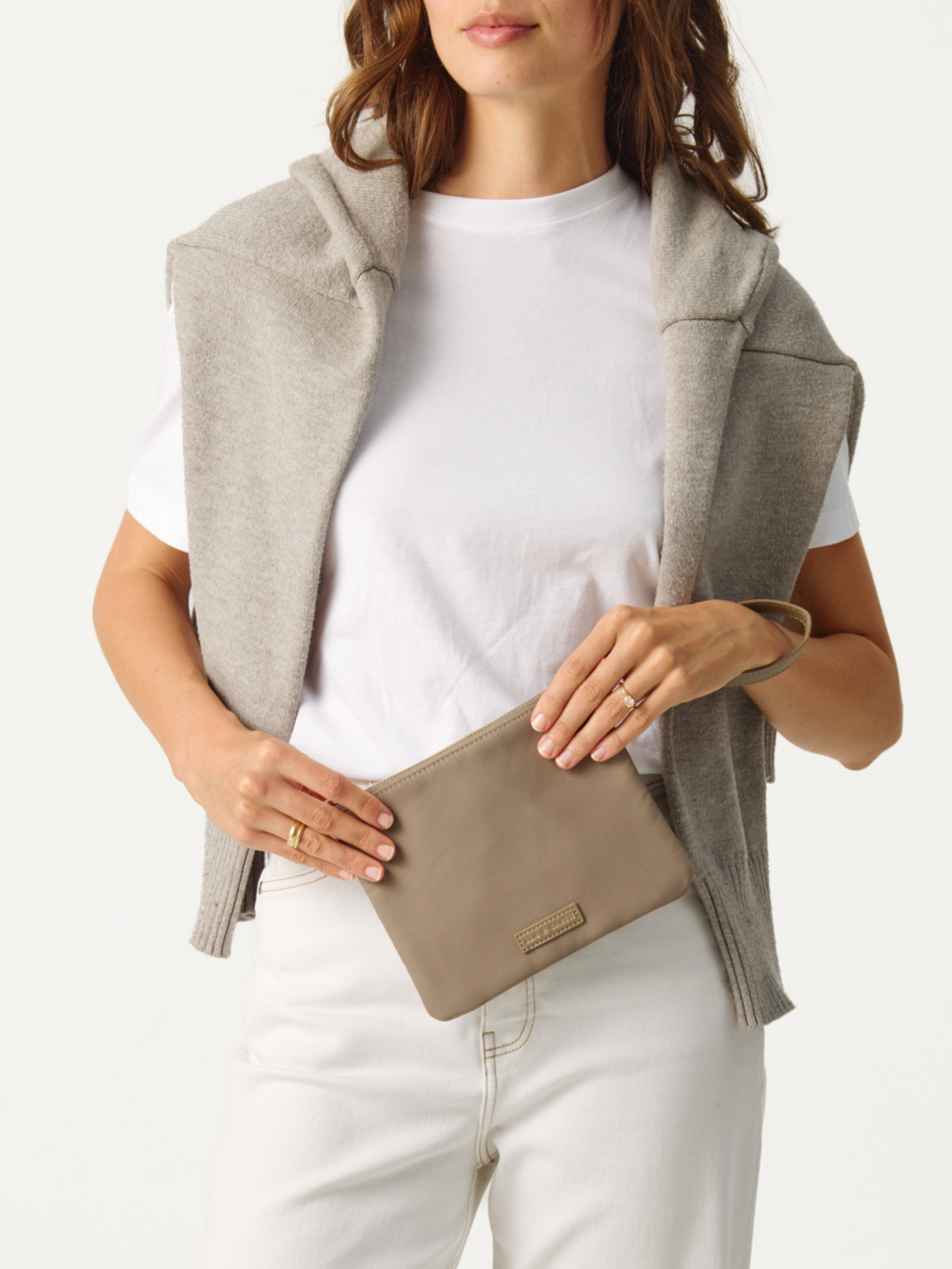 Model holding the Oyster Pouch 