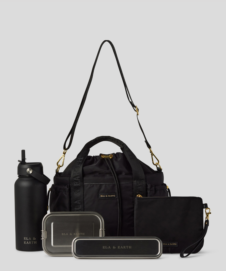 Black Lunch Bucket Bag set on a light gray studio background. The set includes a tan canvas duffel bag with a long shoulder strap, a matching tan pouch, a brown bottle, a dark gray lunch box, and a black lunch box with gold hardware