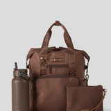 Cocoa Backpack with matching water bottle and pouch on a light gray background