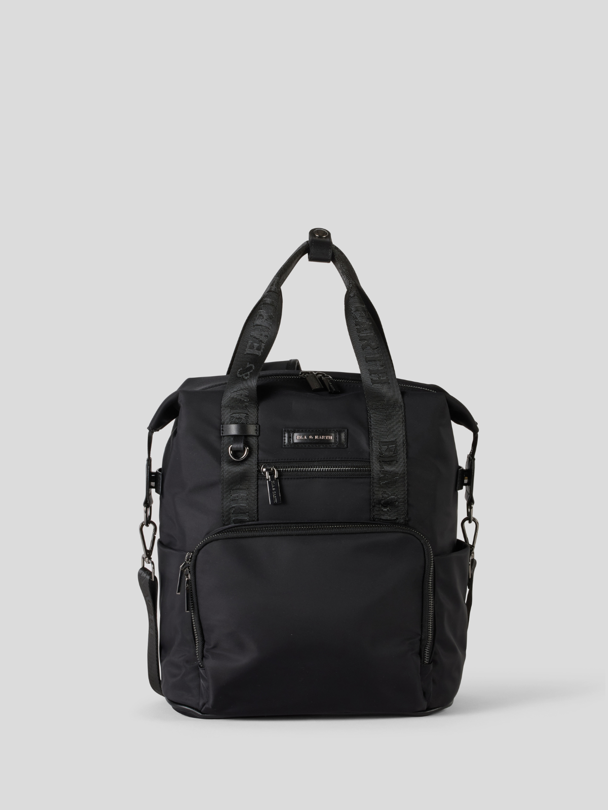 Black backpack on a light gray background