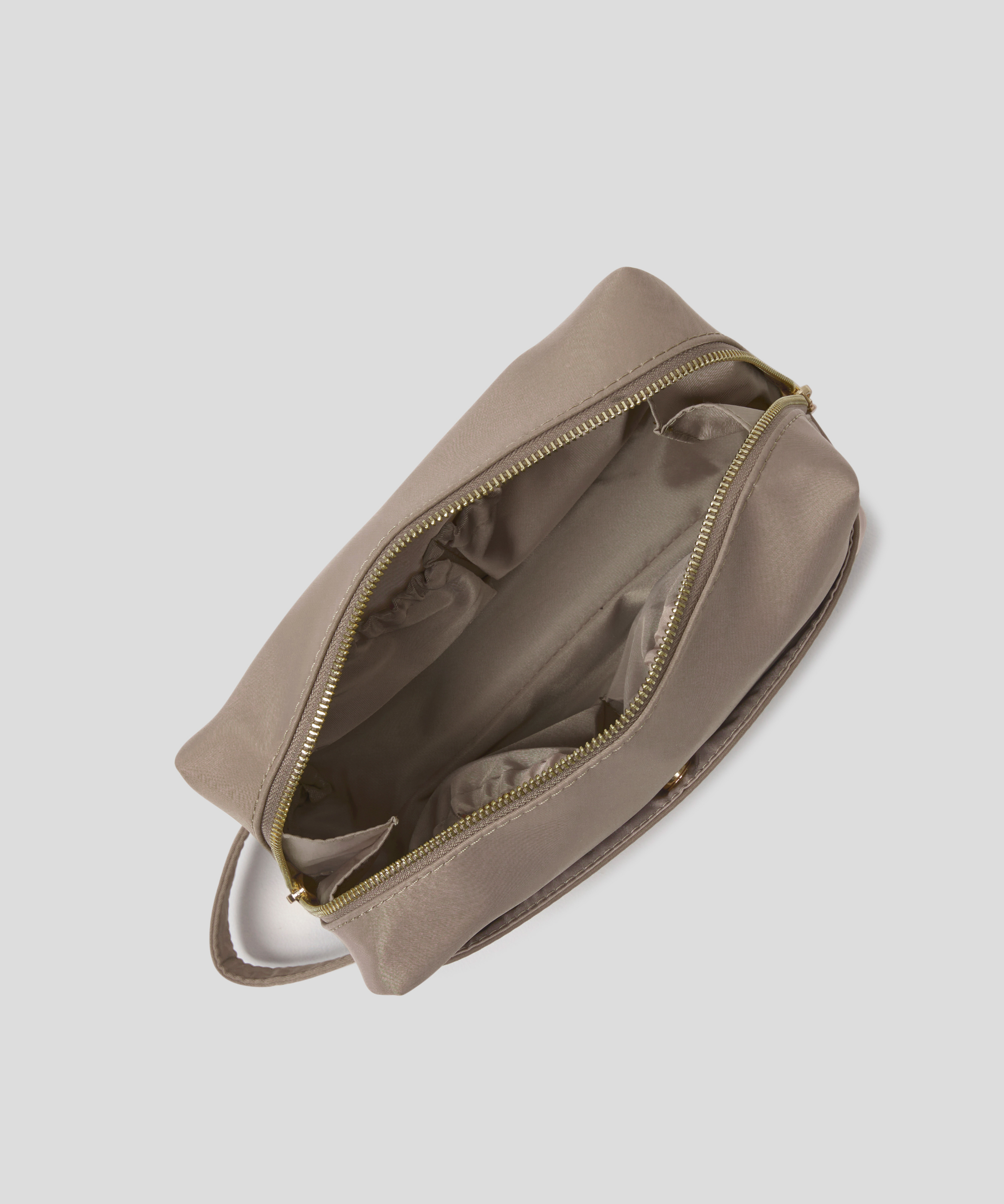Then Oyster zippered pouch shown from an overhead angle, with its zipper open to reveal a matching interior lining, set against a solid light gray background.