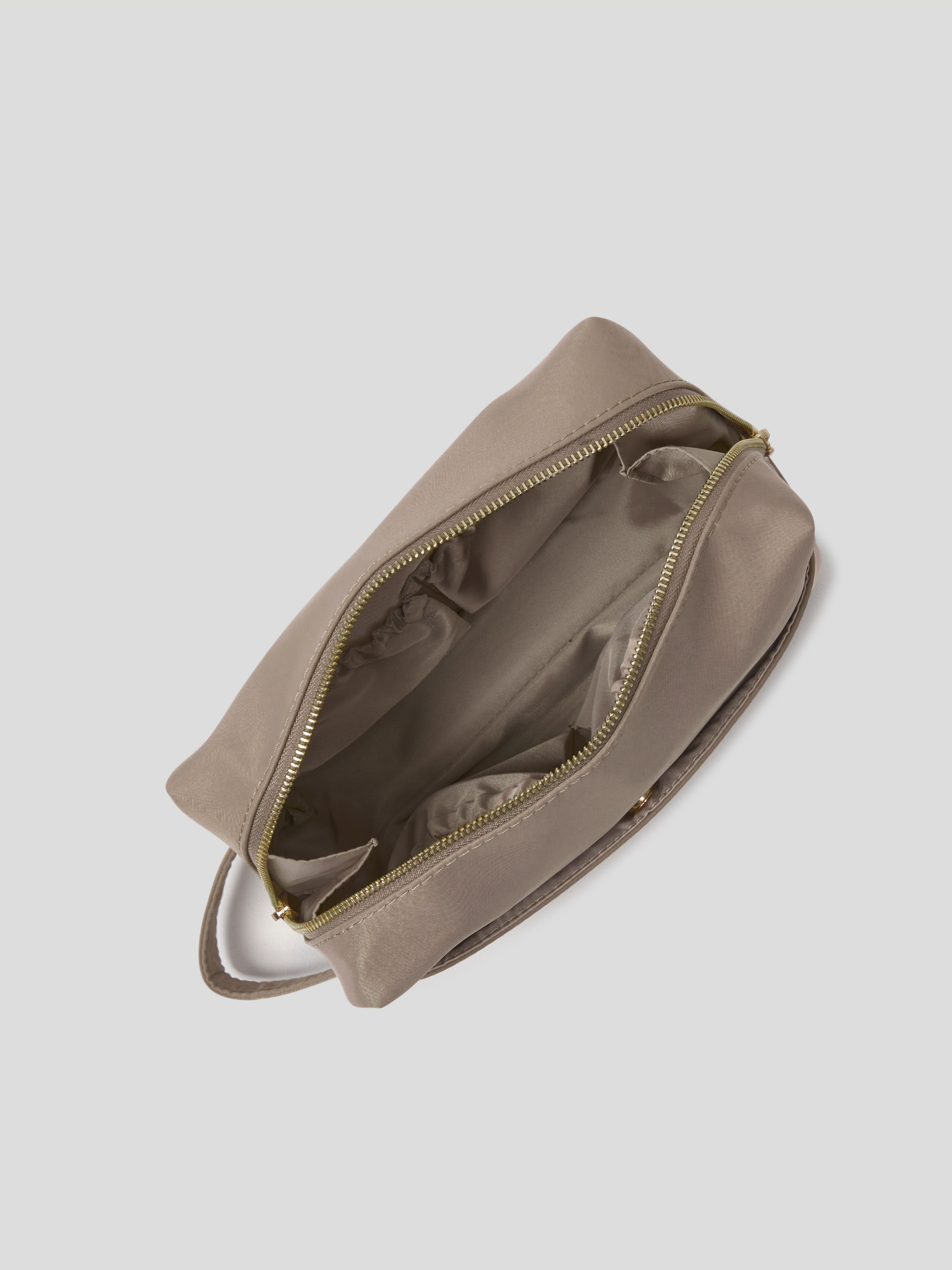 Then Oyster zippered pouch shown from an overhead angle, with its zipper open to reveal a matching interior lining, set against a solid light gray background.