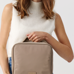 Model holding  a Fold Out Toiletries Bag 