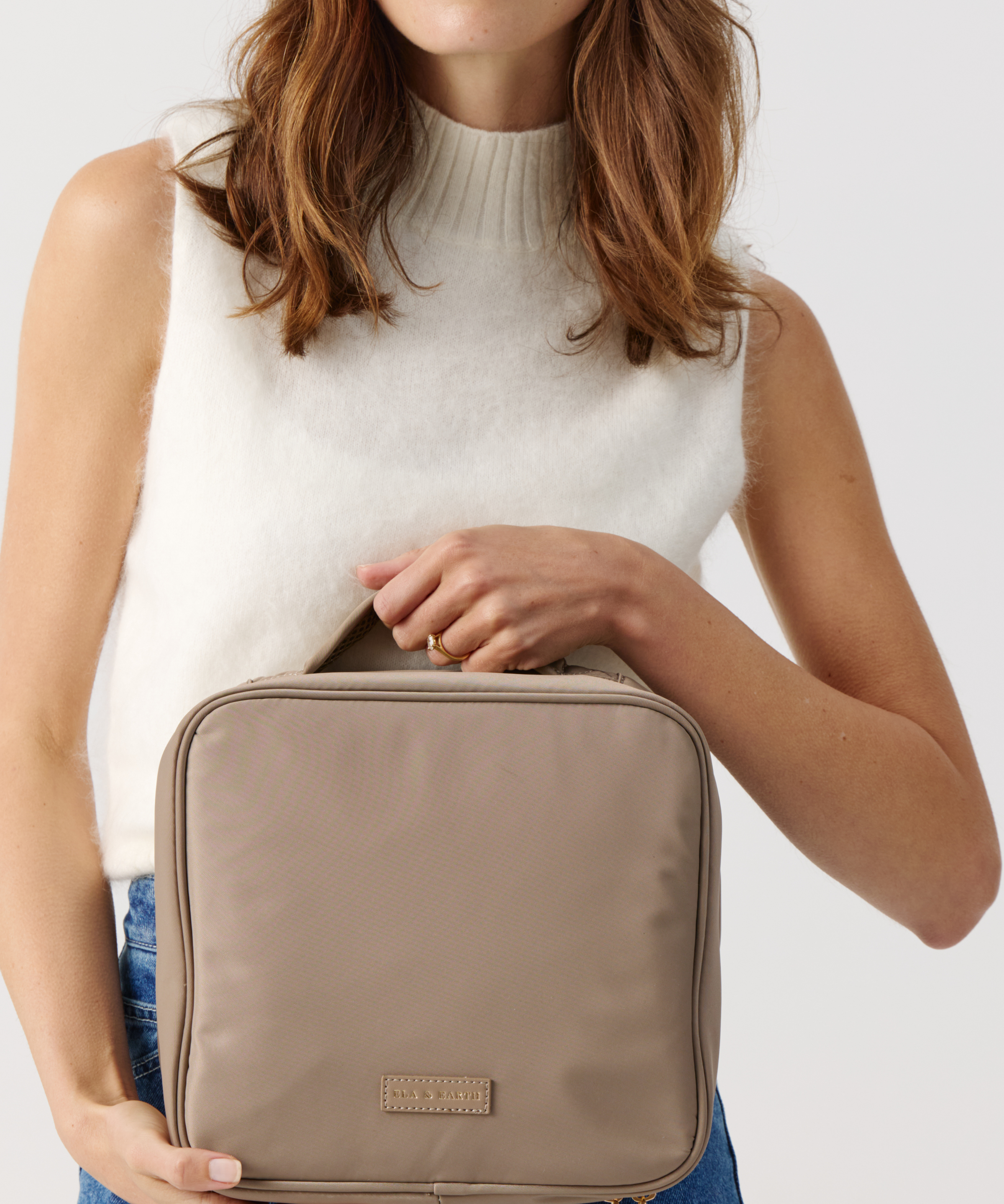 Model holding  a Fold Out Toiletries Bag 