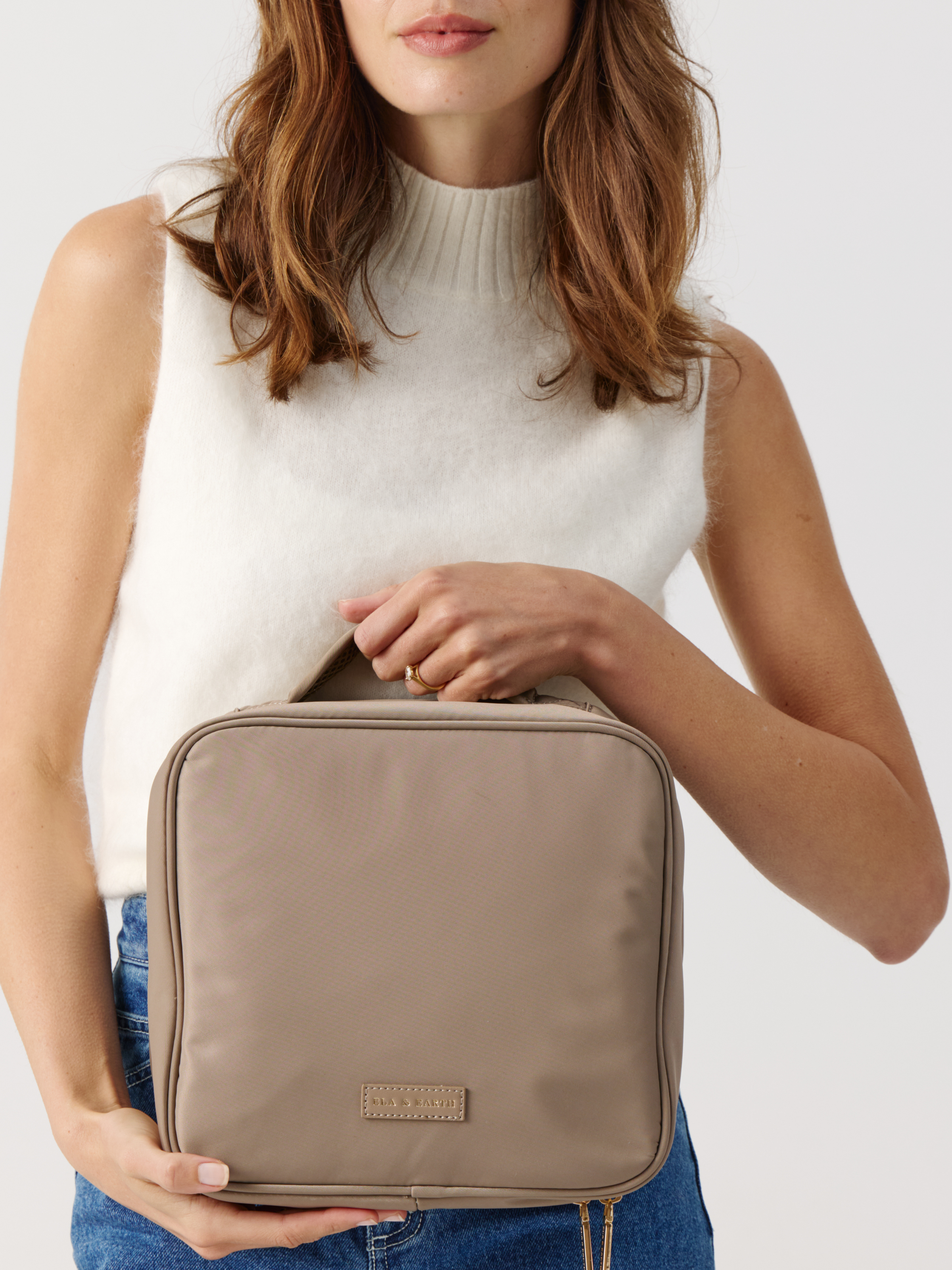 Model holding  a Fold Out Toiletries Bag 
