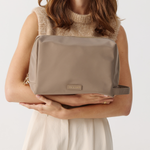 Model holding Toiletries Pouch 