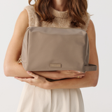 Model holding Toiletries Pouch 