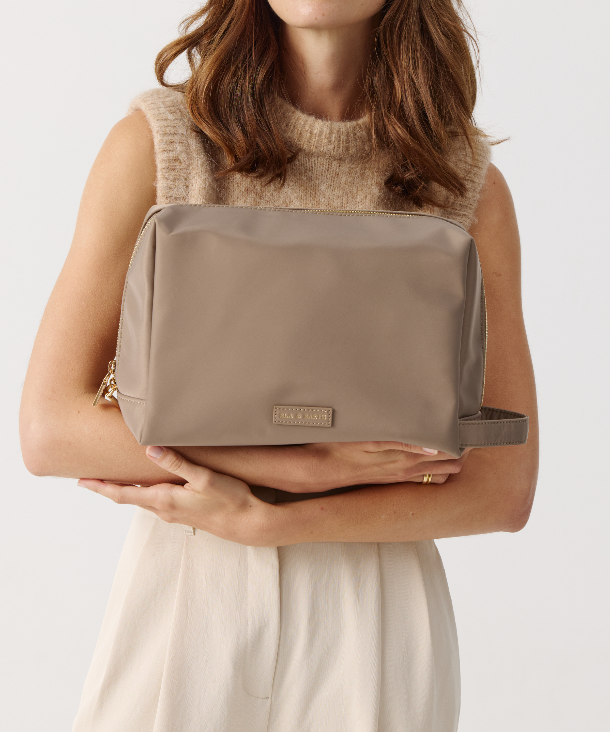 Model holding Toiletries Pouch 