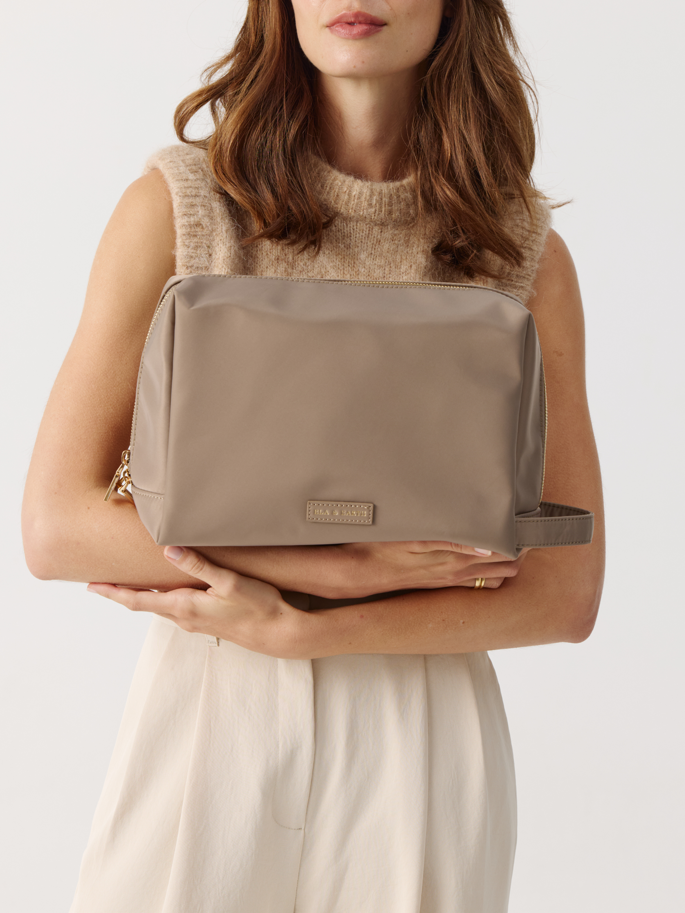 Model holding Toiletries Pouch 